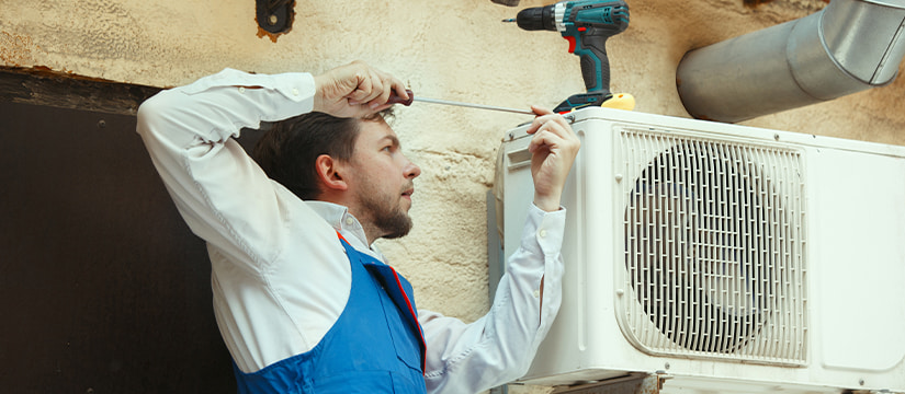 Professional HVAC technician performing heating and air conditioning repair
